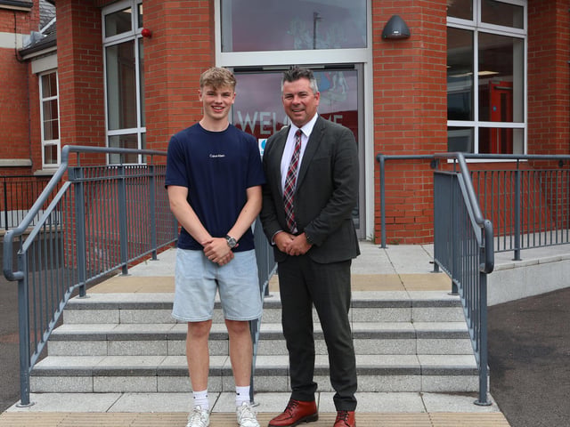 A smile for the camera from this 3 A Star Grades student pictured with Rainey headmaster Mr Mark McCullough.