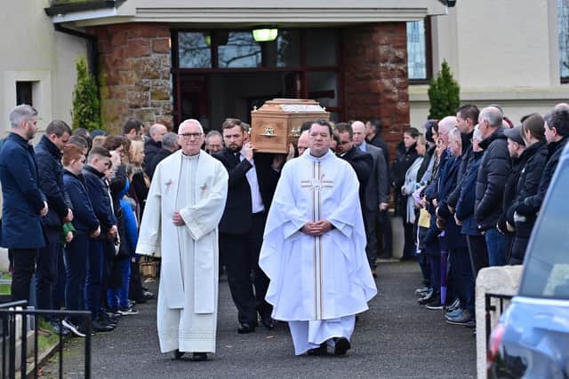 Family and friends of Patrick Rogers during his funeral at St Joseph and St Malachy’s Drummullan on Friday. Pic Colm Lenaghan/ Pacemaker