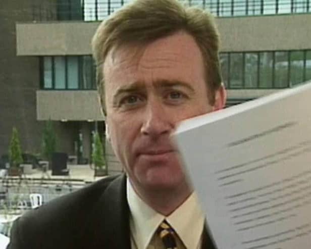 Stephen Grimason holding a copy of the Good Friday Agreement in April 1998. Picture: BBC