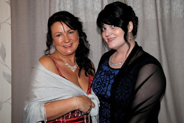 Laura Shaw and Laura Murphy at the Macmillan Cancer Care charity ball in Larne Masonic Centre. INLT 24-245-AM