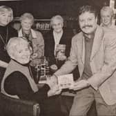 Danny Doran presents a copy of his Song for the Milleniun to best selling author Alice Taylor who took part in the last of the series of the 'Books Across The Border' community centre at Newry Library.
