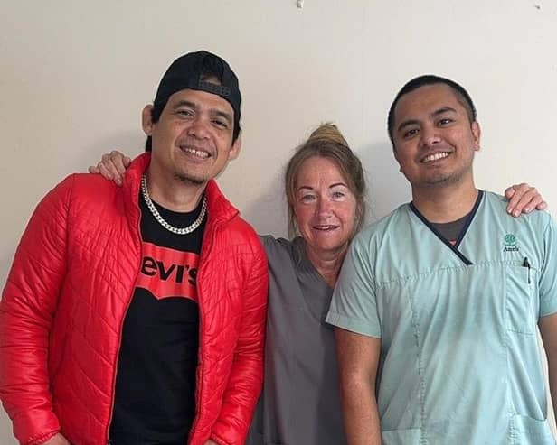 Mahon Road Care Home staff members Archie (Ruarch Del Rosario), Sarah Brown and Elvis Remparas are looking forward to their abseil down the Europa Hotel. Picture: Michelle Cassidy Jones.