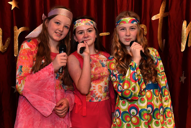 Tia, Lucy and Mia who played 'The Crooks' in the 1970s Top Of The Pops themed Ballyoran Primary School nativity play. PT50-613.