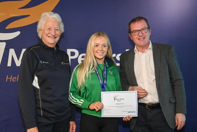 Lisburn tennis player Isabella Connor has received a Mary Peters Trust athlete award. Isabella collected her award from Lady Mary Peters and Trust Chair, Barry Funston.