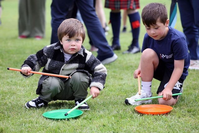 Young spectators enjoy making music.