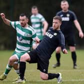 Cleary Celtic midfielder Mark Hughes battles with Newry Celtic player Stephen Wylie at Olympic Park on Saturday. Pics: Brendan Monaghan