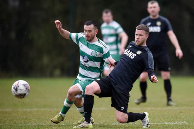 Cleary Celtic midfielder Mark Hughes battles with Newry Celtic player Stephen Wylie at Olympic Park on Saturday. Pics: Brendan Monaghan