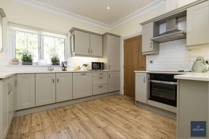 The lovely open plan kitchen leads to the dining and living areas. It has an extensive range of high and low level luxury kitchen units with upgraded granite worktop and tiled splashback.