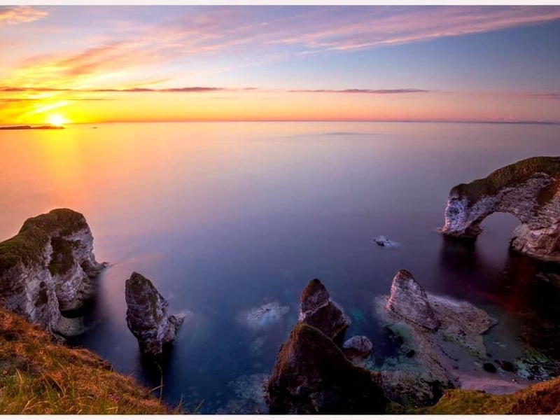This fabulous image of the Wishing Arch at Magheracross was submitted by David Getty. Magheracross view point is situated on the Dunluce Road, Bushmills, and offers panoramic views of the Causeway Coast's stunning natural environment and coastal headlands. Visitors can enjoy views of the iconic Dunluce Castle and the Skerries, as well as the vast sandy dunes of Whiterocks Beach.