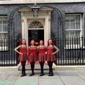 Innova dancers pictured outside the famous black door of No10 Downing Street.