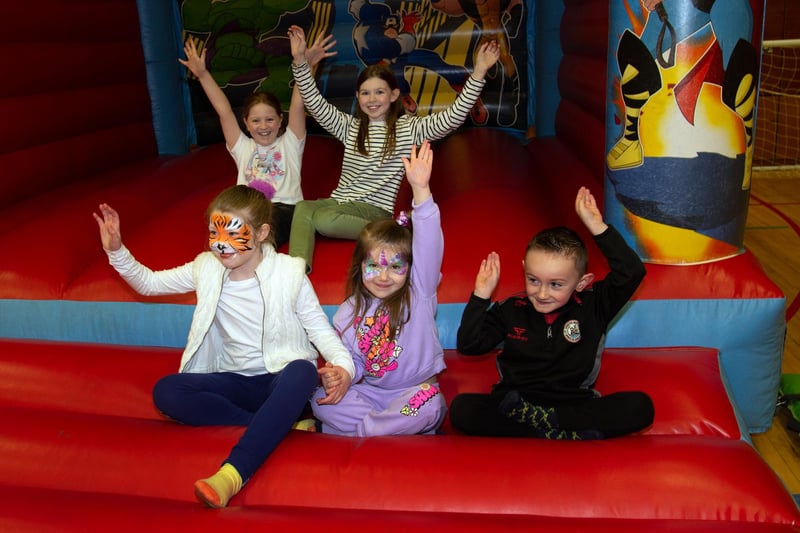 Children who enjoyed the bouncy castles at the Park Road and Obins Street St Patrick's fun day on Saturday. PT11-230.