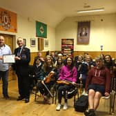 Conrad Clarke, Chairman Mid Armagh Community Network, Keith Lyttle, Fiddle Tutor Mid Armagh Community Network, John Robinson, Chairman Portadown Branch of The  Royal British Legion, and members of the Orchestra during a practice night in Markethill, Co Armagh.