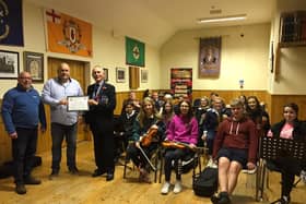 Conrad Clarke, Chairman Mid Armagh Community Network, Keith Lyttle, Fiddle Tutor Mid Armagh Community Network, John Robinson, Chairman Portadown Branch of The  Royal British Legion, and members of the Orchestra during a practice night in Markethill, Co Armagh.