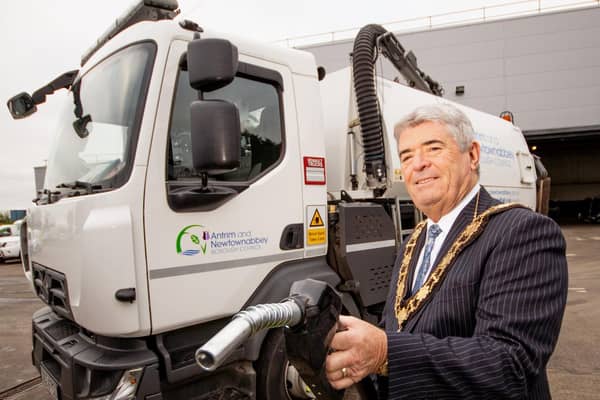 Cllr Billy Webb MBE at a council vehicle which was taking part in a vegetable oil trial. Photo submitted by Antrim and Newtownabbey Borough Council.
