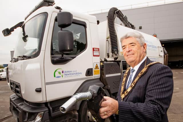 Cllr Billy Webb MBE at a council vehicle which was taking part in a vegetable oil trial. Photo submitted by Antrim and Newtownabbey Borough Council.