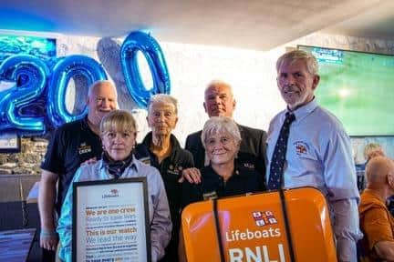 The six people from Portrush RNLI teams who signed the scroll (from left) John Martin, Judy Nelson, Jo May, Des Austin, Val McDonald, Carl Kennedy. Credit Portrush RNLI
