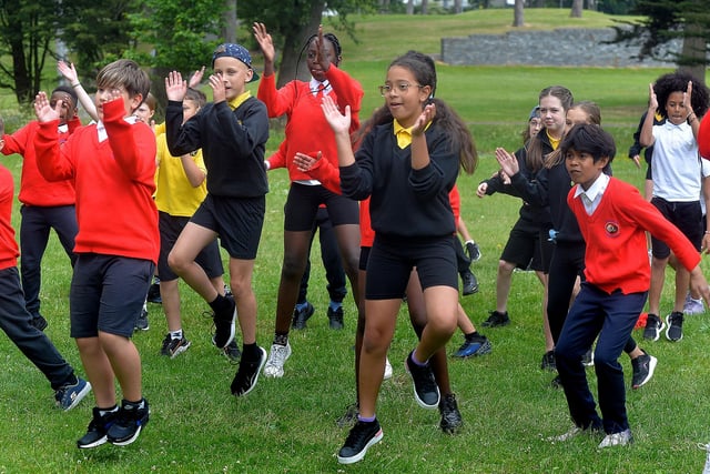 Pupils taking part in a dance / exercise session during the Hart and Presentation Primary Schools joint fun day in Portadown People's Park on Wednesday. PT24-202.