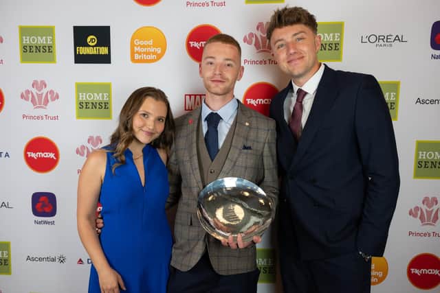 Paul receives his award from Mia McKenna-Bruce and Roman Kemp. Photo: Fanny Beckman