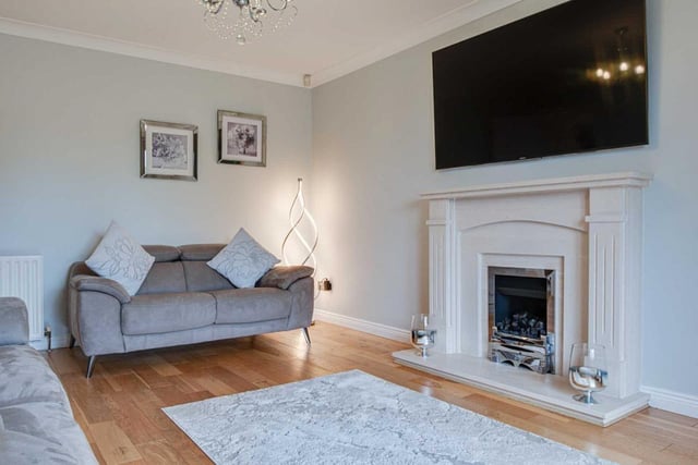 Lounge with feature polished sandstone fireplace.