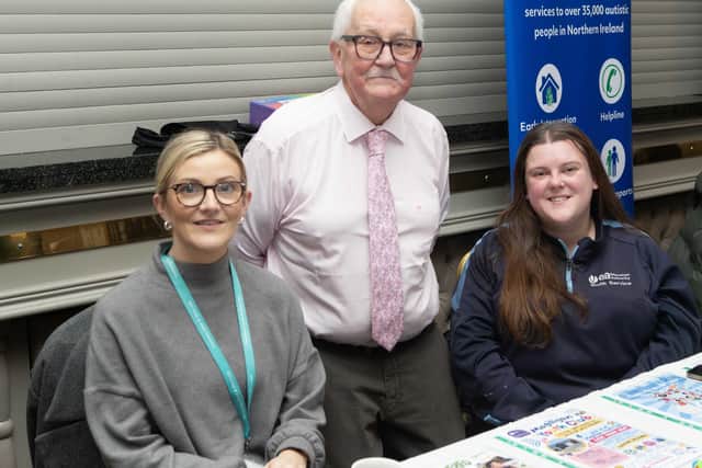 PCSP Chairperson Cllr Oliver McMullan with Caitlin Morgan and Christine O'Neill from EA’s youth service who hosted an information stand at the launch event of the new “We all belong” resource during Hate Crime Awareness Week.