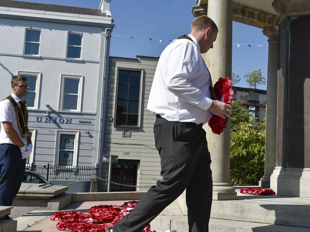 Members of the Royal Black Institution lay a wreath at Lurgan’s War Memorial during their parade around town.
