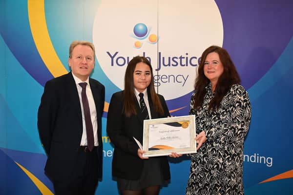 Stephen Martin (Chief Executive, Youth Justice Agency), Competition Runner Up Kaitlin Millar Barrios (Drumglass High School), Colleen Heaney (Assistant Director Western Area Team, Youth Justice Agency) pictured left to right at the Youth Justice Agency’s School Poster Competition Award Ceremony, in the Long Gallery, Parliament Buildings. Credit: Michael Cooper