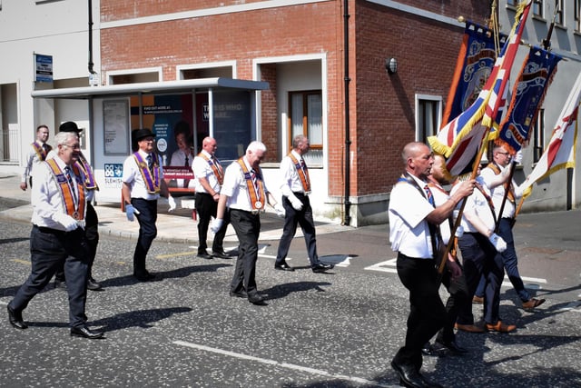 District Officers march in The Square area of Ballyclare.
