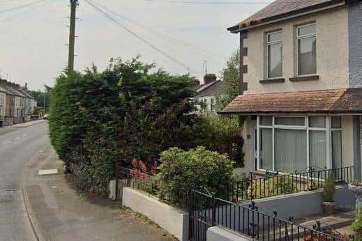 This three-bedroom, end-of-terrace property at 82 Tandragee Road, Portadown, is hidden from view past a sharp bend, and safety concerns have been raised in relation to this. Credit: Google