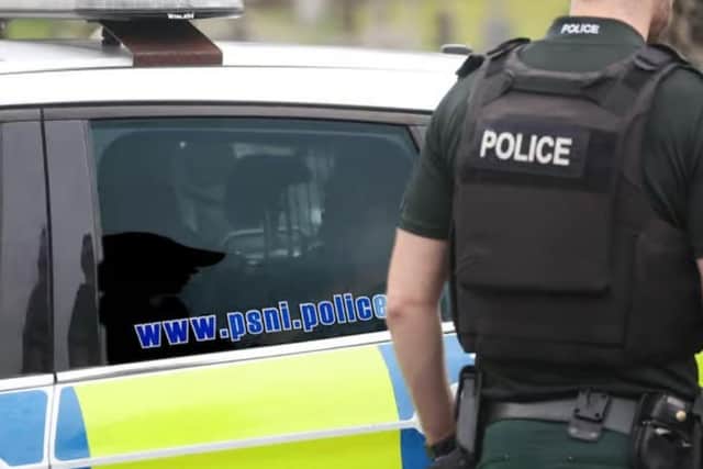 Police car and PSNI officer.