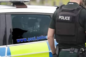 Police car and PSNI officer.