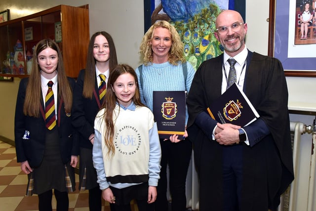 Lurgan Junior High School principal, Mr James McCoy pictured during the school open night with from left, current Year 10 pupils, Leah Constable and Chloe Thompson, Ruby Coey (10) and her mum, Laura. LM02-215.