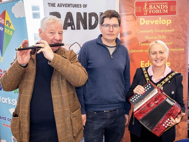 Mayor Cllr Dawn Huggins pictured at the Good Relations Week showcase event in Coleraine Town Hall with Cllr Stephen Callaghan and Andrew Lynch at the Londonderry Bands Forum stand.