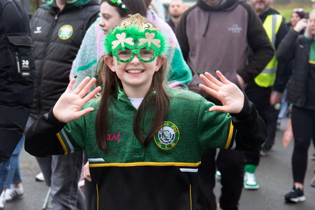 A wave for the camera during the St Paul's GAC St Patrick's Day parade. LM12-220.