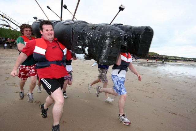 Running into the icy waters at the 2010 Portrush Raft Race