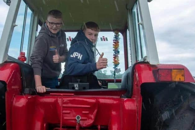 Thomas McClelland, left, and Ali Stanford preparing for the slow tractor race at the Birches Vintage Rally in 2024.  Picture: Tony Hendron