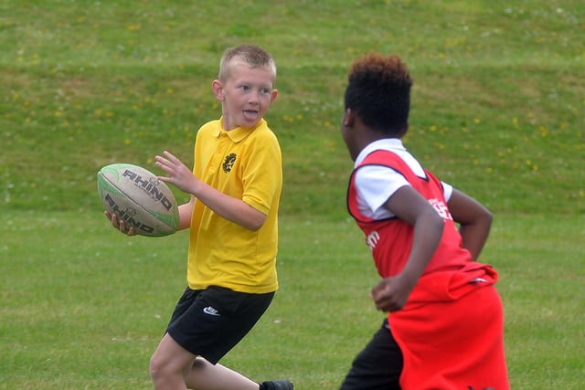 Hart and Presentation Primary School pupils taking part in a mini-rugby game during Wednesday's joint fun day. PT24-213.