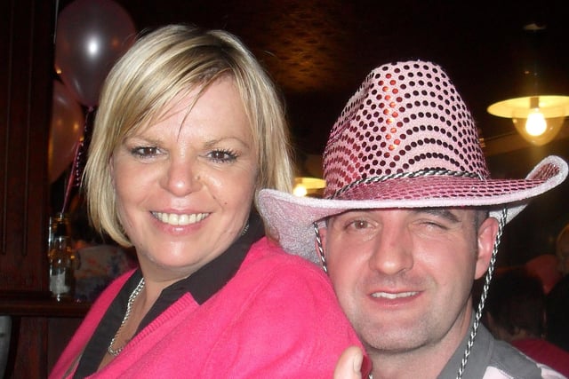 Brian Kearney and Linda Hutton get into the spirit during the Pink Night for the Ulster Cancer Foundation at the Railway Arms Bar, Coleraine in 2009