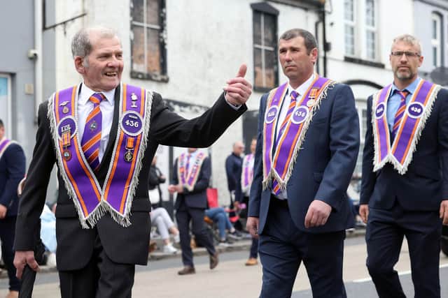 A member of LOL 436 spots a familiar face in the crowd during the 2024 Twelfth parade in Gilford, Co. Down.  Picture: Stephen Davison / Pacemaker