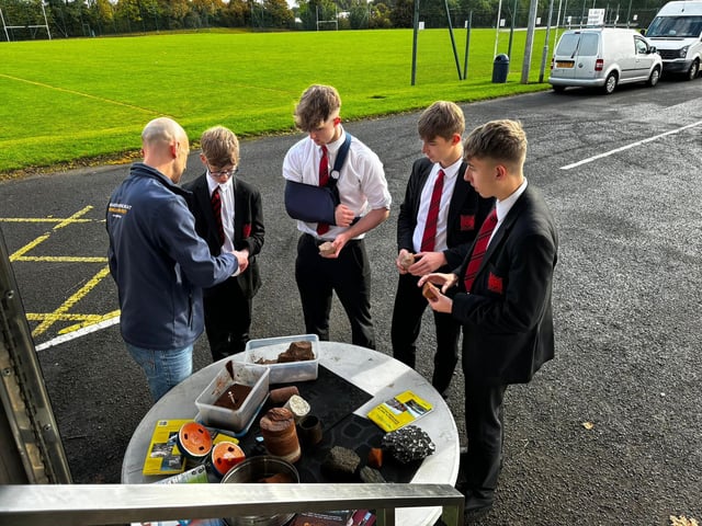 Pupils from Rainey Endowed School are pictured outside the GeoEnergy Discovery Centre as they engage in geothermal experiments with GeoEnergy ambassadors.