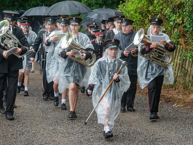 Wrapped up against the rain on Saturday.