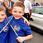 Best of pals ... Alfie Leckey (5), left, and Archie Herron (6) ready to take part in the parade.  PT24-242.