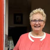 Brenda Campbell in the doorway of her home at The Alms Houses Annahilt. Pic credit: Clanmil