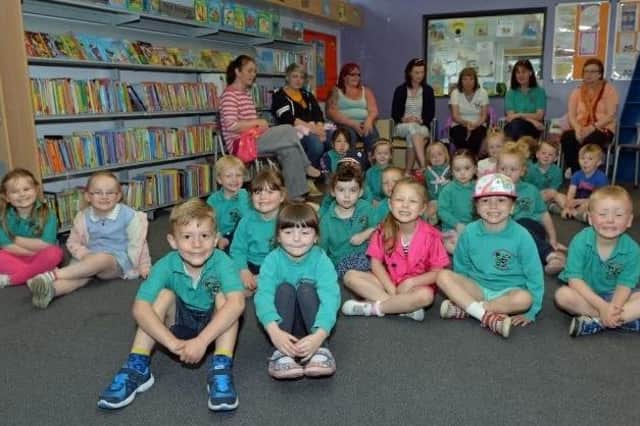 Children from Glengormley Integrated Primary School nursery pictured with their leaders and asssistants on their visit to Glengormley Library in 2015.