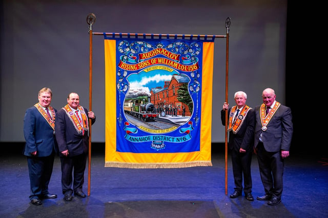 The Grand Master and Deputy Grand Master pictured with the ‘Banner of the Year’ from Aughnacloy Rising Sons of William LOL 156. Pic by Graham Baalham-Curry