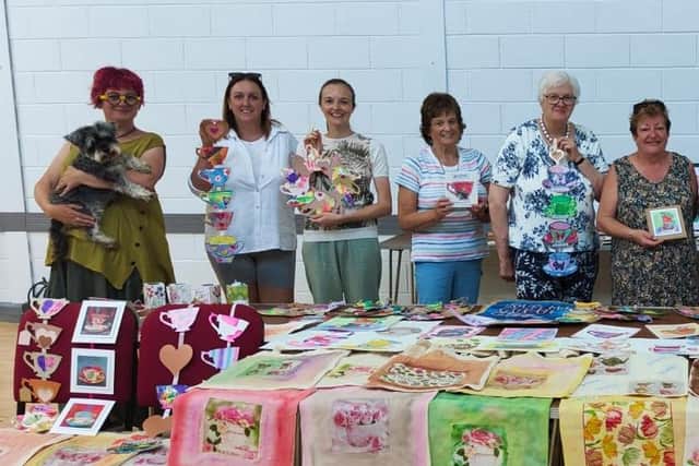 Craft group participants with artist Norma Beggs (with Diva). Photo courtesy of Glenlough Community Centre.