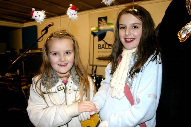 Rebecca and Naomi Finlay push the button to turn on the lights at the Christmas festivities in Ballymoney back in 2006