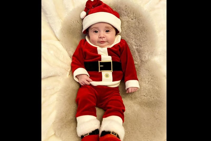 A Santa outfit for little Sebastian.