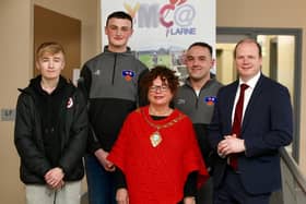 Minister Gordon Lyons MLA alongside Mayor of Mid and East Antrim Ald Gerardine Mulvenna with James, Jayden and Dean from Larne YMCA. (Pic: Contributed).