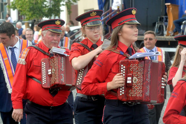 Members of Tullyhappy Accordion Band making their way through Markethill town centre during Saturday night's mini 12th parade. PT27-275.