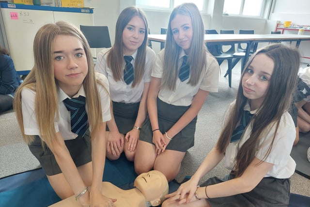 Chloe Parke, Lily Jones and Katie Elliott from Ballymoney High School learning how to perform CPR during the Health & Social Care workshop at Northern Regional College. Credit: NRC